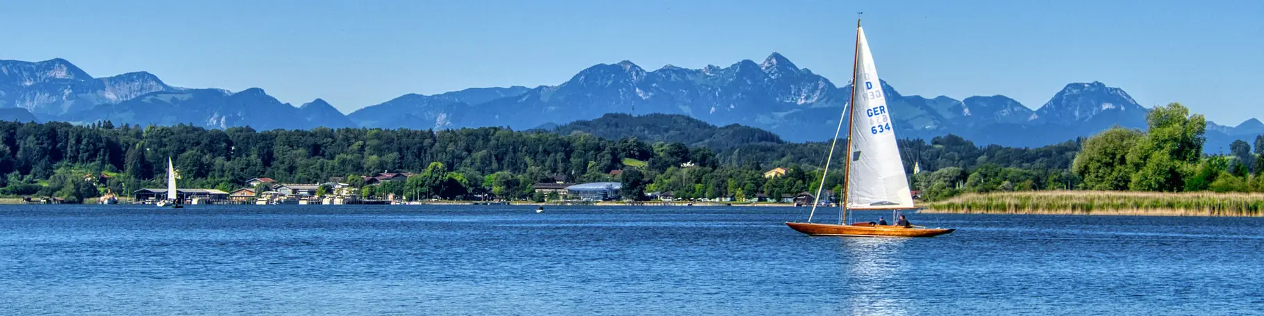 im Urlaub auf dem Bauernhof am Chiemsee eine Segeltour machen